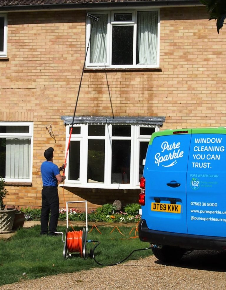 Showing window cleaner with water fed pole